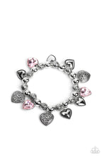 Load image into Gallery viewer, Decorative silver filigree, silver-studded, and pink gem heart charms swing from a collection of shiny silver beads, and silver beads with a dot motif. Threaded along an elastic stretchy band, the charming bracelet creates a timeless romantic centerpiece around the wrist.  Sold as one individual bracelet.
