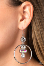 Load image into Gallery viewer, Dangling from an asscher-cut white gem, a trio of white and iridescent geometric-shaped gems glimmer inside airy silver hoops. Earring attaches to a standard fishhook fitting. Due to its prismatic palette, color may vary.  Sold as one pair of earrings.
