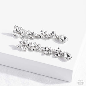 Radiant clusters of white reflective teardrop, marquise-cut and round gems combine with classic white pearls to create an explosion of glitz that extends down the ear. Hanging from the bottom of the light-reflecting earring, a white, reflective teardrop gem swings for some eye-catching shimmer against a backdrop of high-sheen silver. Earring attaches to a standard post fitting.  Sold as one pair of post earrings.