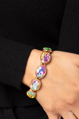 Iridescent gems are pressed into sleek gold frames. Infused with dainty gold beads, the sparkly frames are threaded along stretchy bands for a glamorous look around the wrist. Due to its prismatic palette, color may vary.  Sold as one individual bracelet.