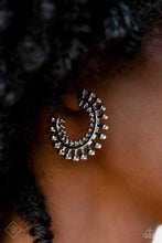 Load image into Gallery viewer, Tactile silver studs fan out along a classic silver hoop, erupting into a brilliant display of texture and sheen. Smaller studs line the inner edge of the hoop, adding additional eye-catching detail to the adventurous design. Earring attaches to a standard post fitting. Hoop measures approximately 1 1/4 in diameter.
