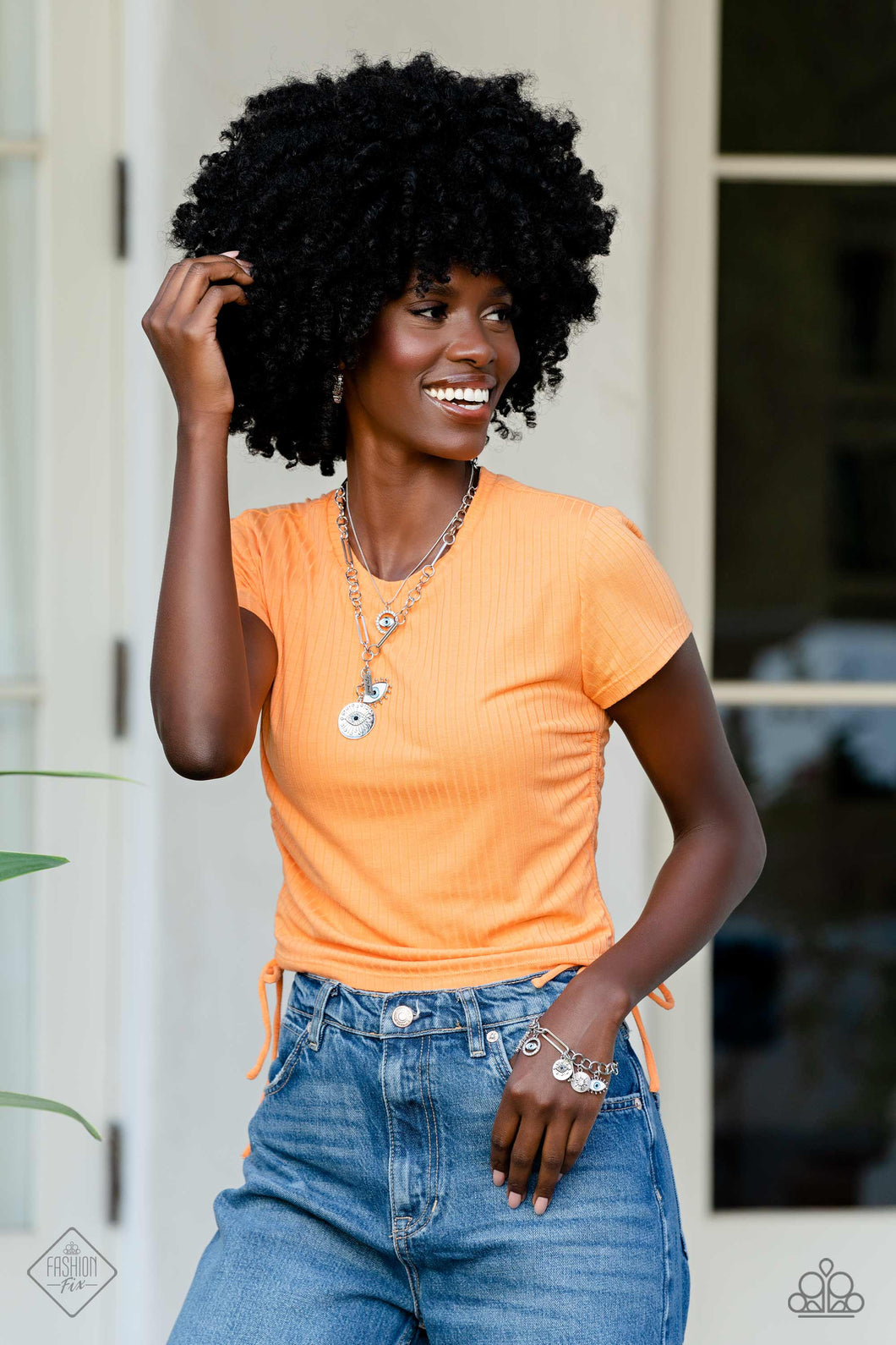 Necklace set including two necklaces, bracelet and earrings displayed on a Model.