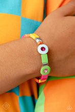 Load image into Gallery viewer, Alternating along the wrist in a whimsically colorful pattern, a collection of stacked silver cube beads, and multicolored metallic squares are threaded along an elastic stretchy band. Three circular frames, in Pantone® shades of Classic Green, Summer Song, and Fuchsia Fedora, haphazardly interrupt the cubed beading, showcasing their colorful rhinestone centers for additional contrast around the wrist.
