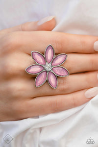 Glassy marquise-cut petals in a dreamy orchid hue, fan out around a sparkling white gem center, creating a vibrant, oversized flower that sits prominently atop the finger. Features a stretchy band for a flexible fit.