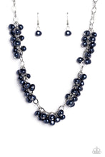 Load image into Gallery viewer, A cascade of Montana Blue pearly beads dangle from a high-sheen silver, oval linked chain. The pearly beads cluster across the neckline, creating a refined pop of color. Features an adjustable clasp closure.  Sold as one individual necklace. Includes one pair of matching earrings.
