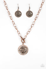 Load image into Gallery viewer, Embossed in a whimsical rosebud pattern, a shimmery copper frame swings below the collar for a casual look. Features a toggle closure. Sold as one individual necklace. Includes one pair of matching earrings.
