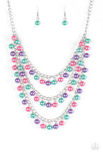Load image into Gallery viewer, Classic green, pink, and purple pearls trickle from three shimmery chains below the collar, adding a timeless twist to a traditional pearl palette. Features an adjustable clasp closure.  Sold as one individual necklace. Includes one pair of matching earrings.
