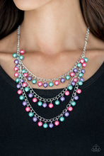 Load image into Gallery viewer, Classic green, pink, and purple pearls trickle from three shimmery chains below the collar, adding a timeless twist to a traditional pearl palette. Features an adjustable clasp closure.  Sold as one individual necklace. Includes one pair of matching earrings.
