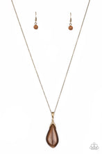 Load image into Gallery viewer, Infused with a topaz rhinestone encrusted fitting, an asymmetrical brown moonstone swings from the bottom of an elongated brass chain for a whimsical look. Features an adjustable clasp closure. Sold as one individual necklace. Includes one pair of matching earrings.
