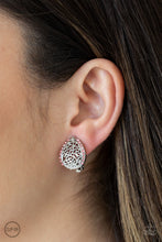 Load image into Gallery viewer, Trimmed in glassy pink rhinestones, vine-like filigree climbs a dainty silver teardrop for a whimsical look. Earring attaches to a standard clip-on fitting. Sold as one pair of clip-on earrings.
