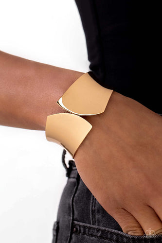 A thick band of high-sheen gold, with its edges seemingly sheared off, creates a sharp, edgy cuff-like bracelet around the wrist. Features a hinged closure.  Sold as one individual bracelet.