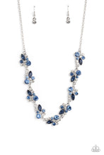 Load image into Gallery viewer, An eclectic collection of white and blue round rhinestones in varying sizes and marquise-cut gems in a blue shade cluster around the collar in high-sheen silver frames. Patterned in an abstract manner, the clusters interlock together, emitting light from every faceted angle. Features an adjustable clasp closure. Includes one pair of matching earrings.
