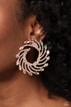 Load image into Gallery viewer, Shimmery strands of shiny copper spin out from an airy center, creating an exaggerated firework-like display at the ear. An explosion of dainty white rhinestones lines the swirls and curves of the shimmery display leading the eye to the collection of iridescent marquise-cut gems at its ends. Each iridescent marquise-cut gem curls around the ear in a clock-like manner, creating additional eye-catching dimension. Earring attaches to a standard post fitting. Due to its prismatic palette, color may vary.
