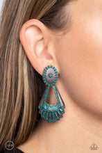 Load image into Gallery viewer, Dangling from a Southwestern-patterned post, a rustic, brass patina frame swings for some aged authenticity below the ear. Feathered details stream from the lower frame for additional artisanal detail. Earring attaches to a standard clip-on fitting.  Sold as one pair of clip-on earrings.
