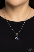 Load image into Gallery viewer, Nestled inside classic silver prongs, two oversized rhinestones, featuring a UV shimmer, slide along a dainty silver snake chain, creating a dramatic pendant below the collar. Features an adjustable clasp closure.  Sold as one individual necklace. Includes one pair of matching earrings.
