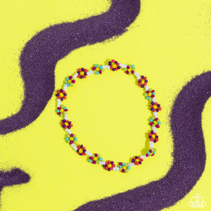 Strung along the entirety of an invisible wire, white seed beads coalesce around the ankle. The row of white seed beads are haphazardly interrupted by blooming colorful seed bead flowers, with yellow centers for a carefree, charismatic finish.  Sold as one individual anklet.