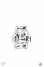 Load image into Gallery viewer, An exaggerated, oversized, rectangular frame encases a large, white, emerald-cut gem, showcasing its scintillating shimmer. Skinny white gems chiseled into rectangular bars are pressed into the top and bottom of the industrial frame, resulting in an unapologetic statement piece with unmatched sparkle. Features a stretchy band for a flexible fit.  Sold as one individual ring.
