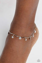 Load image into Gallery viewer, A fringe of sleek silver stars and discs swings from a dainty silver overlay chain, creating whimsical movement around the ankle. Features an adjustable clasp closure.  Sold as one individual anklet.
