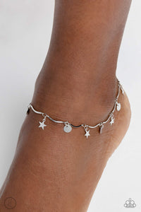 A fringe of sleek silver stars and discs swings from a dainty silver overlay chain, creating whimsical movement around the ankle. Features an adjustable clasp closure.  Sold as one individual anklet.
