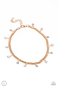 A fringe of dainty pearls and white gems pressed into sleek gold frames wraps around the ankle on a dainty gold chain, creating a glittery, oceanic statement. A second dainty gold chain adds a high-sheen layer for a refined finish. Features an adjustable clasp closure.  Sold as one individual anklet.