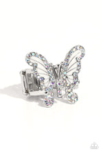Load image into Gallery viewer, Sparkling with dainty, round iridescent rhinestones, a silver butterfly with white wings, fearlessly flutters atop the finger for a statement-making finish. Features a stretchy band for a flexible fit. Due to its prismatic palette, color may vary.  Sold as one individual ring.
