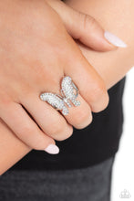 Load image into Gallery viewer, Sparkling with dainty, round iridescent rhinestones, a silver butterfly with white wings, fearlessly flutters atop the finger for a statement-making finish. Features a stretchy band for a flexible fit. Due to its prismatic palette, color may vary.  Sold as one individual ring.
