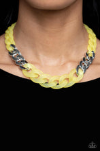 Load image into Gallery viewer, Brushed in a vibrant Empire Yellow finish, a strand of acrylic curb chain combines with links of a silver curb chain to dramatically drape across the chest for a whimsical yet bold look. Features an adjustable clasp closure.  Sold as one individual necklace. Includes one pair of matching earrings.
