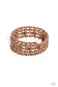 Coiling around the wrist, striped copper beads of varying sizes, interacts with brass accents, copper wheel beads, and copper discs for an eye-catching, endless design.  Sold as one individual bracelet.
