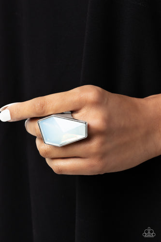 A whimsical oversized opalescent bead featuring sharp geometric angles is pressed into a sleek, thick silver frame for a light-reflecting centerpiece atop the finger. Features a stretchy band for a flexible fit.  Sold as one individual ring.