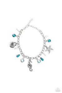 Dainty baroque pearls, clear Harbor Blue and Waterspout faceted beads in silver frames, intricate silver seahorse, starfish, and sea scallop seashell charms, and milky Harbor Blue and Waterspout teardrop beads swing from a silver link chain, creating a beachy fringe around the wrist. Features an adjustable clasp closure.  Sold as one individual bracelet.