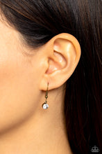 Load image into Gallery viewer, Clear rhinestone hanging from a brass fish hook earring.
