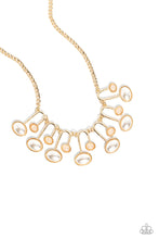 Load image into Gallery viewer, Encased in sleek gold casings, oversized white pearls and shimmery beads lay horizontally across the chest on curved horseshoe-like frames. Delicately stamped in golden studs, the abstract frames swing from the bottom of a classic gold chain for a monochromatic, sophisticated look. Features an adjustable clasp closure.  Sold as one individual necklace. Includes one pair of matching earrings.
