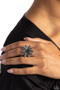 Unfurling around an emerald gem center, textured and studded silver petals alternate atop airy silver bands on the finger for a whimsically botanical centerpiece. Sold as one individual ring.