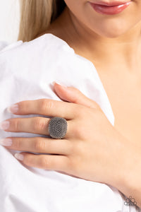 Dotting the surface of an extended silver frame, dainty silver studs seemingly pop off the finger, reflecting light off its every surface for an industrial finish. Features a stretchy band for a flexible fit.  Sold as one individual ring.
