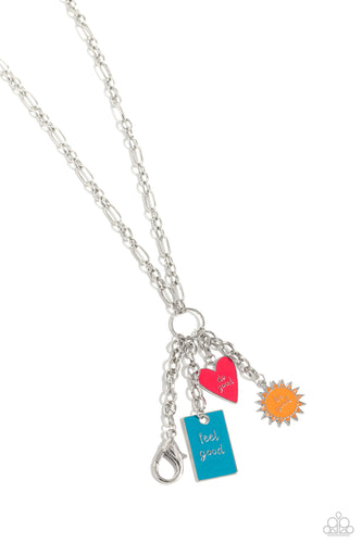 Featuring a glossy finish, a Pink Peacock heart, orange sun, and turquoise rectangle cascade from the bottom of a lengthened, trendy silver chain. Inscribed on each charm, the phrases 