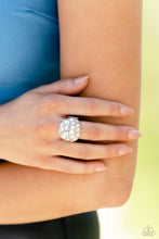 Load image into Gallery viewer, A studded silver frame, filled with blinding oval-cut gems in opalescent, white, and iridescent shades, stands out atop the finger for a blingy statement. Features a stretchy band for a flexible fit. Due to its prismatic palette, color may vary.  Sold as one individual ring.
