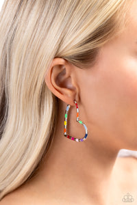 A simple silver hoop of silver curves around the ear into a heart-shaped frame. Featured on the heart frame, multicolored stripes alternate with the high-sheen finish of the silver for a lasting impression. Earring attaches to a standard post fitting. Hoop measures approximately 1 3/4" in diameter.  Sold as one pair of hoop earrings.