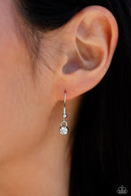 Load image into Gallery viewer, Small rhinestone hanging from a fish hook earring.
