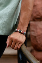 Load image into Gallery viewer, Sections of green, blue, red, brown, and black leather wrap around an urban brown leather band. Emerald-cut silver frames stud the centers of each multicolored suede band, adding a touch of industrial grit to the rustic display. Features an adjustable snap closure.  Sold as one individual bracelet.
