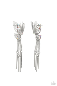 Featuring dainty white rhinestones and dainty marquise-cut iridescent gems, a thin, elongated, airy silver butterfly is titled to the side as if about to take off in flight. A collection of dainty silver rods swings from dainty silver chain tassels at the bottom of the whimsical frame for some free-falling movement. Earring attaches to a standard post fitting. Due to its prismatic palette, color may vary.  Sold as one pair of post earrings.