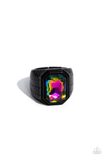 Load image into Gallery viewer, Featuring a regal emerald style cut, a glittery oil spill gem is pressed into a sleek black frame featuring a thick black band embossed in bold textures. Features a stretchy band for a flexible fit.  Sold as one individual ring.
