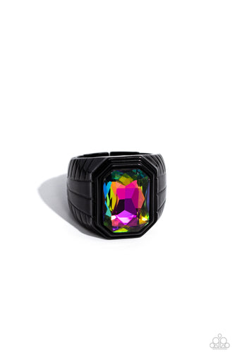 Featuring a regal emerald style cut, a glittery oil spill gem is pressed into a sleek black frame featuring a thick black band embossed in bold textures. Features a stretchy band for a flexible fit.  Sold as one individual ring.