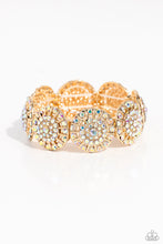 Load image into Gallery viewer, Featuring a wheel motif, concaved gold discs embossed in an explosion of iridescent rhinestones slide along a stretchy band around the wrist for a hint of dazzling refinement. Due to its prismatic palette, color may vary.  Sold as one individual bracelet.
