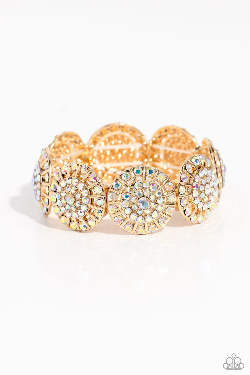 Featuring a wheel motif, concaved gold discs embossed in an explosion of iridescent rhinestones slide along a stretchy band around the wrist for a hint of dazzling refinement. Due to its prismatic palette, color may vary.  Sold as one individual bracelet.