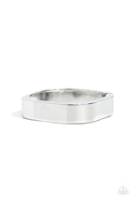 Load image into Gallery viewer, Featuring a sleek, high-sheen finish, a thick silver cuff asymmetrically wraps around the wrist, creating a tilted square centerpiece for a monochromatic staple. Features a hinged closure.  Sold as one individual bracelet.

