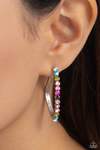 The front of a bold silver hoop is encrusted in multicolored rhinestones, creating a sparkly spectrum of color. The multicolored scalloped frame leisurely bends into an airy triangular frame for a geometric motif. Earring attaches to a standard post fitting. Hoop measures approximately 1/2