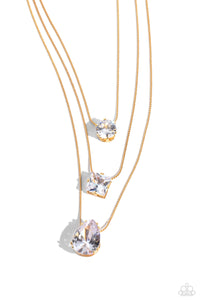 Featuring a subtle iridescent finish, exaggerated, faceted round, square, and teardrop gems layer down the chest from three sleek gold dainty chains, in a refined fashion. Features an adjustable clasp closure. Due to its prismatic palette, color may vary.  Sold as one individual necklace. Includes one pair of matching earrings.