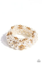 Load image into Gallery viewer, Infused with white rhinestone-encrusted gold beads, white rhinestone-encrusted discs, and textured gold beads, a bubbly collection of mismatched white pearls are threaded along stretchy bands around the wrist for a vintage-inspired layered look.  Sold as one set of four bracelets.
