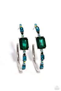 Encrusted in round and emerald-cut aquamarine and emerald gems, some featuring an iridescent sheen, an exaggerated oblong silver hoop curls around the ear, refracting light in a dramatic, knockout finish. Earring attaches to a standard post fitting. Hoop measures approximately 2" long. Due to its prismatic palette, color may vary.  Sold as one pair of hoop earrings.