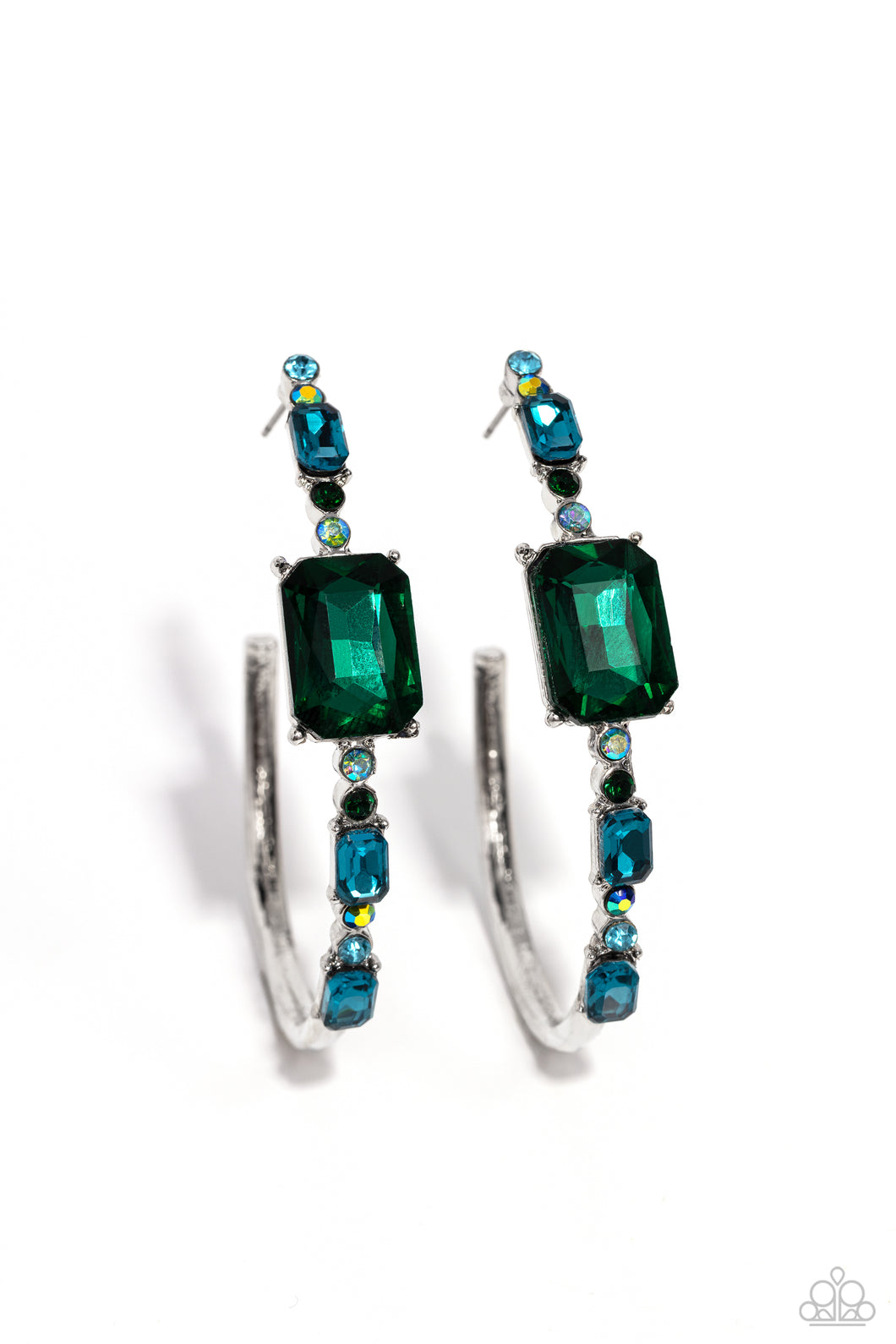 Encrusted in round and emerald-cut aquamarine and emerald gems, some featuring an iridescent sheen, an exaggerated oblong silver hoop curls around the ear, refracting light in a dramatic, knockout finish. Earring attaches to a standard post fitting. Hoop measures approximately 2
